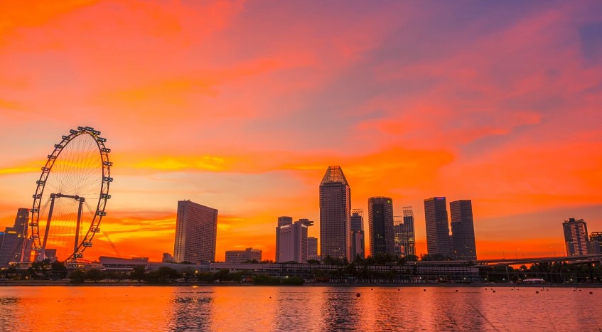 The Singapore Flyer stands tall against a breathtaking sunset