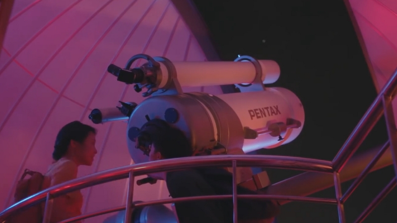 A Large Pentax Telescope at The Science Centre Observatory, with Visitors Looking Up