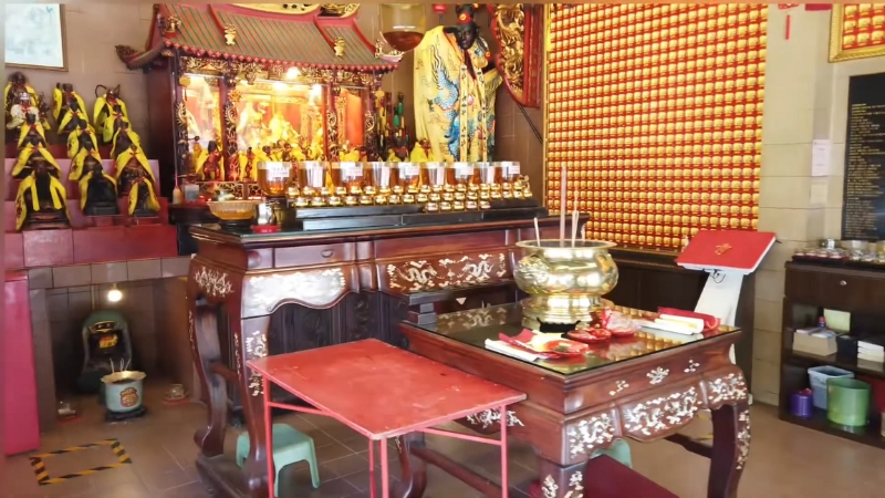 Interior of Qi Tian Gong Temple in Tiong Bahru with statues, incense, and ornate altars