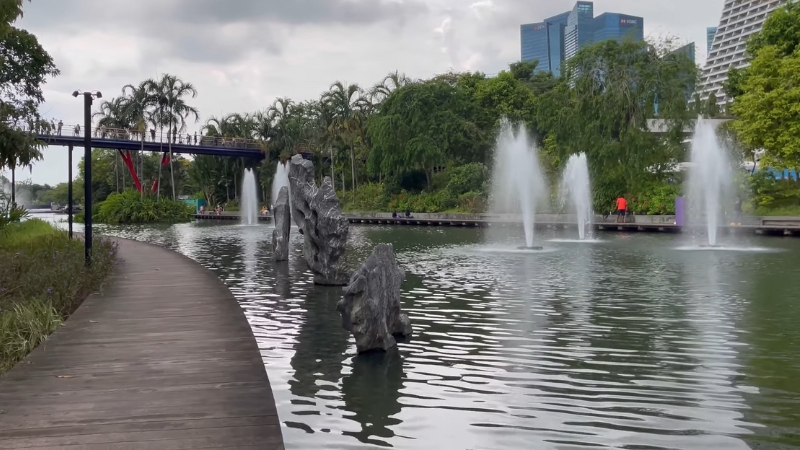 Fountains and rock formations create a calm waterfront view in the Chinese Garden at Heritage Gardens