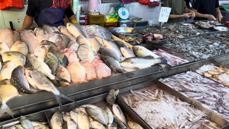 Fresh seafood on display at a Singapore wet market where many authentic street foods begin